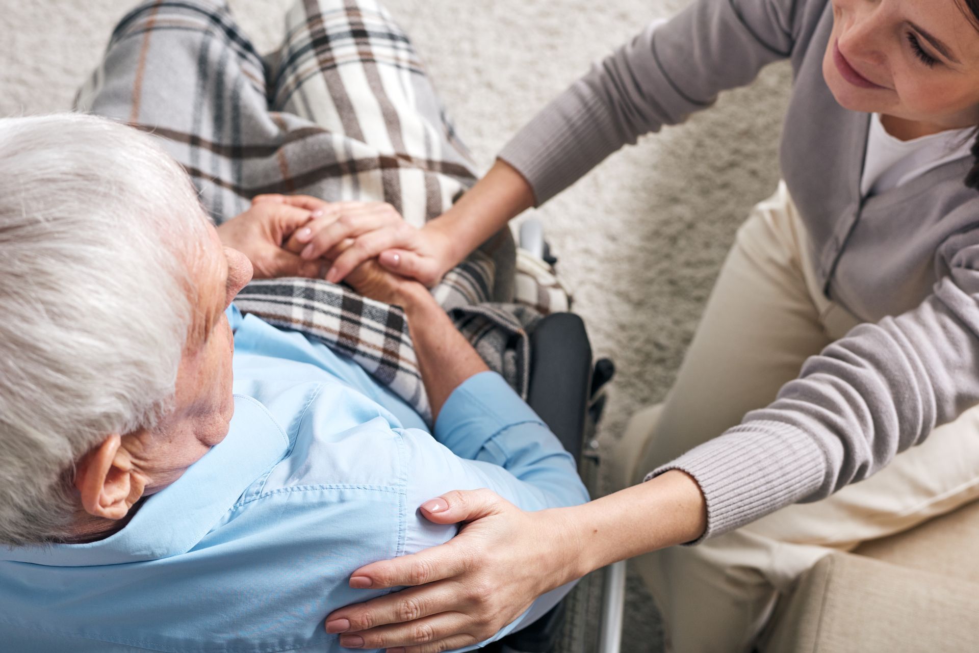 A loving caregiver with a senior resident